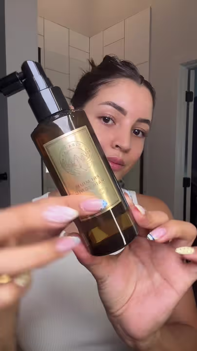 Luisa presenting a product from her haircare routine